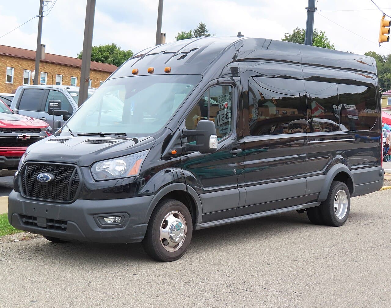 Ford Transit Bus photograph. Overseas passenger van example; Australian Bus seating and specification may differ.