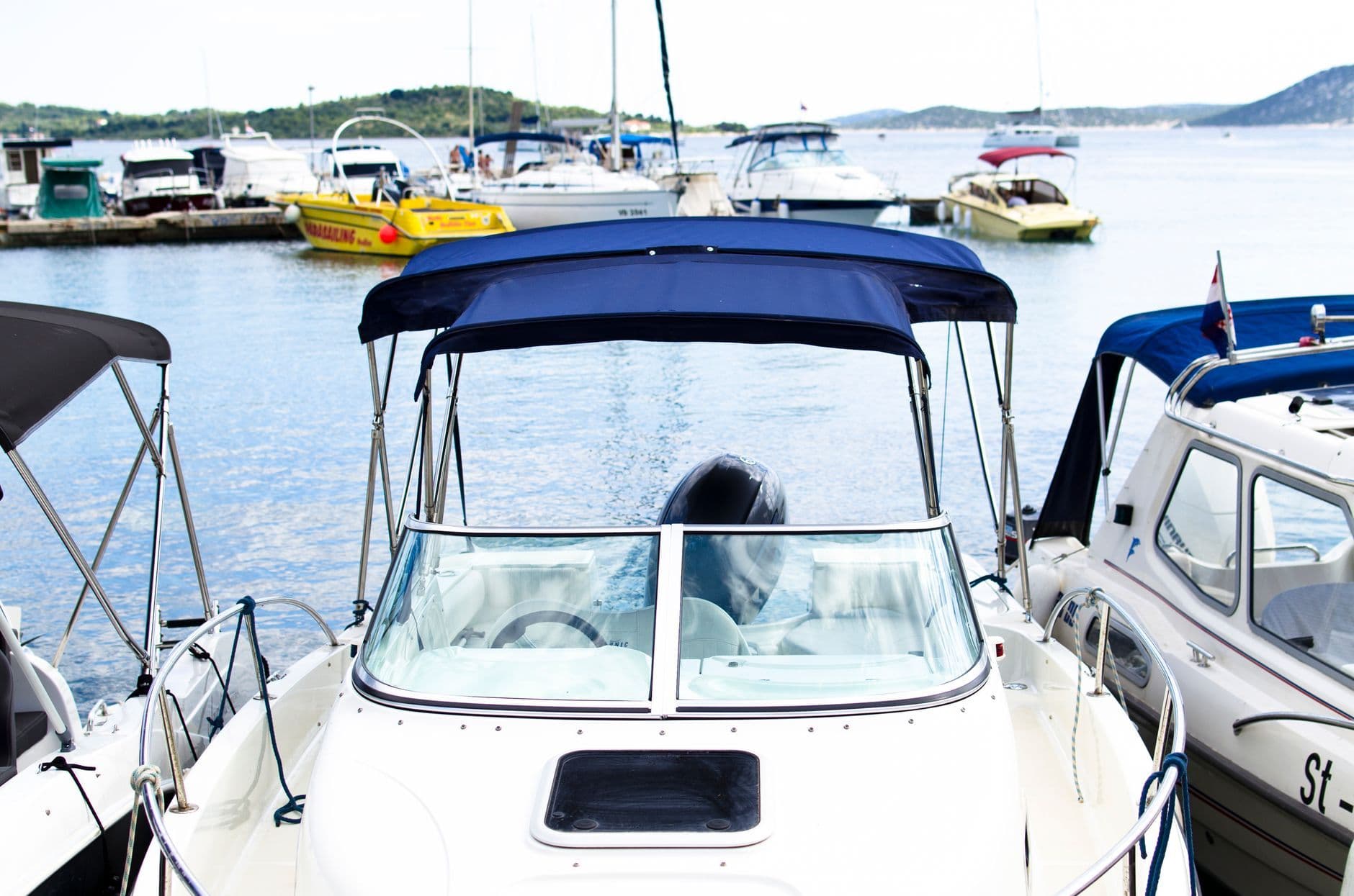 Motorboats moored alongside each other