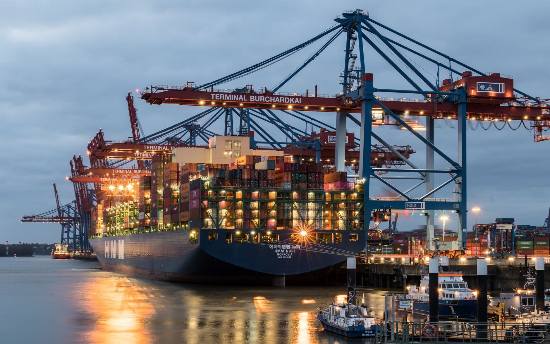 Container ship and cargo cranes at a port