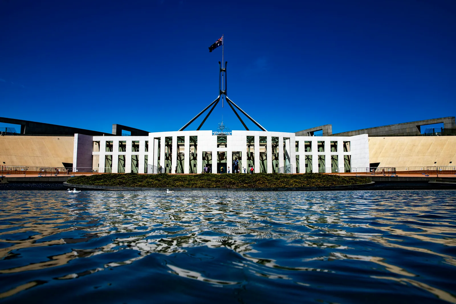 Australian Parliament House in Canberra under a blue sky